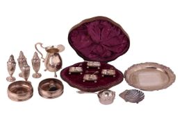 A cased set of four Victorian silver salts, fluted circular form, each on three ball feet, with gilt