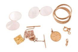 Two 9ct gold dress studs, one of rounded rectangular design, featuring a surface pattern of raised s