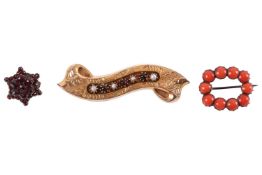 Three gem-set brooches; to include a brooch of scroll form with foliate engravings, alternating with