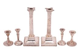 A pair of Victorian silver candlesticks, corinthian columns with swag decorated sconces and detachab