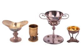 Lalounis, a gilded pedestal cup, the hammered tapering cylindrical beaker with mythical dolphin supp