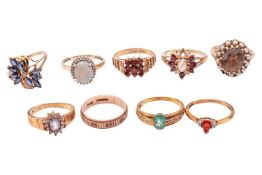 A collection of nine gem-set rings in 9ct gold; to include examples of an opal and diamond halo ring