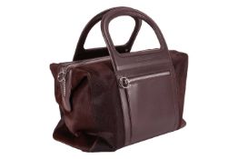 Salvatore Ferragamo - a handbag in brown pony hair and leather trim, top zip closure and a side comp
