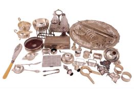 A George III four-bottle cruet stand and bottles; of rounded rectangular form with tongue and dart b