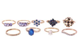 A collection of nine gem-set rings in 9ct gold; to include a blue spinel ring in size S; two tanzani