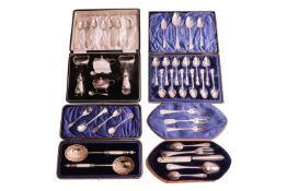 A cased set of twelve late Victorian silver soft fruit spoons, Sheffield 1899; a cased table cruet s