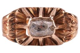 A diamond-set ring, with an old-cut diamond of rectangular form, set within a closed-back bezel sett