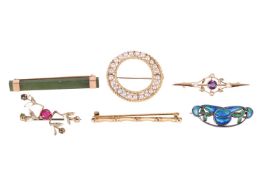 A collection of six brooches; to include a cultured pearl wreath brooch in yellow metal marked ‘18’,