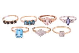 A group of seven gem-set rings in 9ct gold; to include a teal kyanite three-stone ring in size S; a 