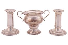 A pair of Victorian silver dwarf candlesticks with nozzles, 10.8 cm high; and an Edwardian silver sm
