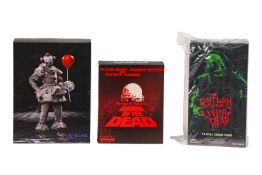 A One:12 Mezcotoyz Dawn of the Dead 'Plaid Shirt Zombie' and 'Flyboy Zopmbie' figure set, in origina