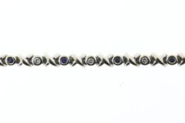 White gold tennis bracelet with diamond and sapphire