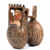 Peru, Vicus, 500 BCE-200 CE, a double chambered stirrup spout vessel showing a bust under a roof,