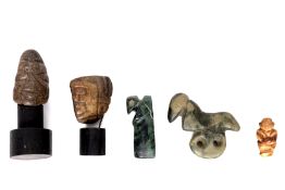 West Mexico, Chontal culture, two stone heads and a miniature figure, 500 BCE - 200 CE.