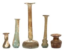 A collection of five Roman glass flasks, ca. 3rd century CE;