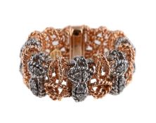 ROBERTO COIN, A DIAMOND SET ARTICULATED DRESS RING