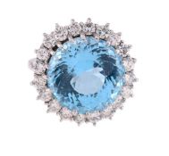 A BLUE TOPAZ AND DIAMOND CLUSTER RING
