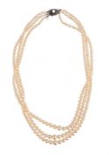 MIKIMOTO, A THREE ROW CULTURED PEARL NECKLACE