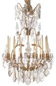 A BRASS AND CUT GLASS TWELVE LIGHT CHANDELIER, 20TH CENTURY