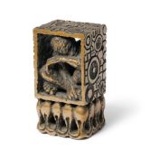 A BRONZE SCULPTURE OF AN ENCASED FIGURE