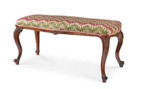 A VICTORIAN WALNUT LONG STOOL, MID-19TH CENTURY