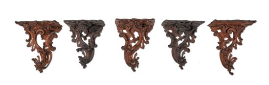 A SET OF FIVE OAK WALL BRACKETS IN 18TH CENTURY STYLE