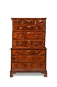 A GEORGE II WALNUT AND OAK FEATHERBANDED CHEST ON CHEST, CIRCA 1750