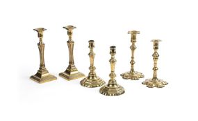 A GROUP OF SIX BRASS CANDLESTICKS TO INCLUDE A CLOSELY MATCHED 18TH CENTURY PAIR AND TWO LATER PAIRS