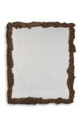 A CORK FRAMED MIRROR, MODERN