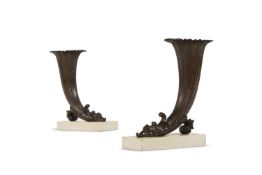 A PAIR OF REGENCY BRONZE RHYTON VASES ON WHITE MARBLE BASES, EARLY 19TH CENTURY