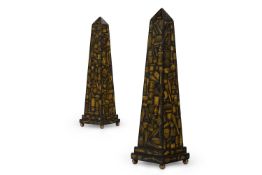A PAIR OF BLACK PAINTED AND GILT DECOUPAGE DECORATED WOODEN OBELISKS, MODERN