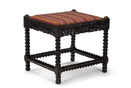 Y A CARVED EBONY STOOL, CEYLONESE, SECOND HALF 19TH CENTURY