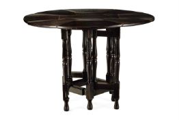AN ARTS AND CRAFTS EBONISED OAK DROP-LEAF GATELEG TABLE, EARLY 20TH CENTURY