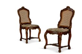 A PAIR OF PARCEL GILT AND OAK SIDE CHAIRS, LATE 19TH/EARLY 20TH CENTURY, IN THE LOUIS XV STYLE
