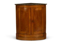 A FRUITWOOD BOW FRONTED CORNER CUPBOARD, FRENCH, EARLY 19TH CENTURY
