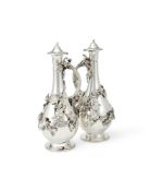 A PAIR OF VICTORIAN SILVER BALUSTER CLARET JUGS