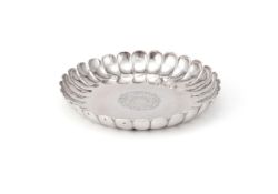 A GEORGE I SILVER SHAPED CIRCULAR STRAWBERRY DISH