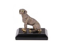A GOLD COLOURED AND DIAMOND SET MODEL OF A DOG