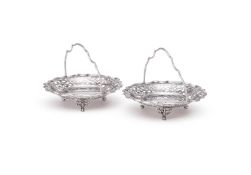 A PAIR OF EDWARDIAN SILVER SHAPED CIRCULAR BASKETS