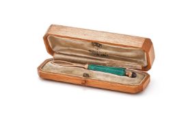 FABERGÉ, A GOLD, ENAMEL AND GARNET BUTTON LOOP