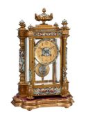 A FRENCH GILT BRASS AND CHAMPLEVE ENAMEL FOUR-GLASS MANTEL CLOCK