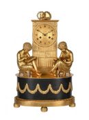 A FRENCH EMPIRE ORMOLU FIGURAL LIBRARY MANTEL CLOCK