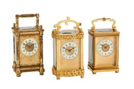 THREE FRENCH GILT BRASS CARRIAGE TIMEPIECES