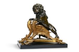 A REGENCE ORMULU AND PATINATED BRONZE LION CHENET, CIRCA 1720