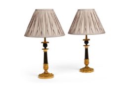 A PAIR OF FRENCH GILT AND PATINATED BRONZE TRIFORM LAMP BASES
