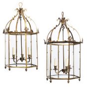 A PAIR OF GILT BRASS HEXAGONAL HALL LANTERNS, IN REGENCY STYLE, LATE 19TH OR EARLY 20TH CENTURY