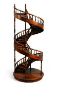 A LARGE SCALE MODEL OF A SPIRAL STAIRCASE, 20TH CENTURY