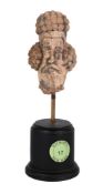 A PARTHIAN TERRACOTTA HEAD OF A MAN, CIRCA 1ST OR 2ND CENTURY A.D.