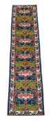 A WOOL RUNNER, IN ARTS & CRAFTS STYLE, AFTER DESIGNS BY CFA VOYSEY, LATE 20TH CENTURY