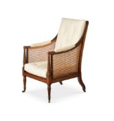 A REGENCY MAHOGANY BERGERE ARMCHAIR, IN THE MANNER OF GILLOWS, CIRCA 1815